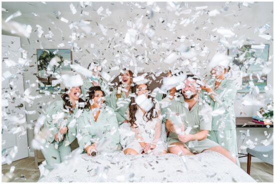 Bridal Party Surrounded by Confetti 
