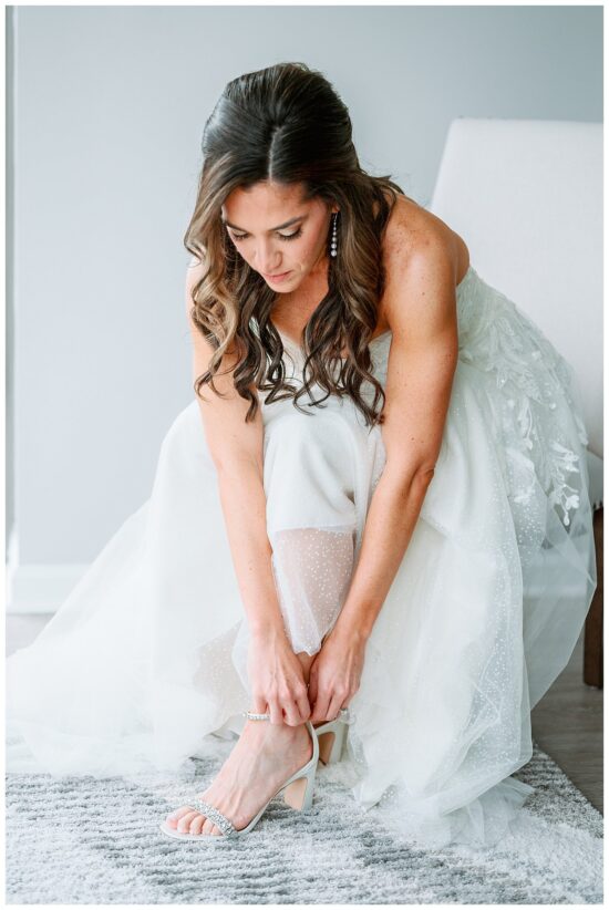 Bride putting on her shoes