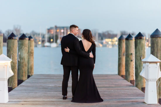 Formal engagement session outfit inspiration in Washington DC. She is wearing a black gown with a low back and he is dressed in a suit