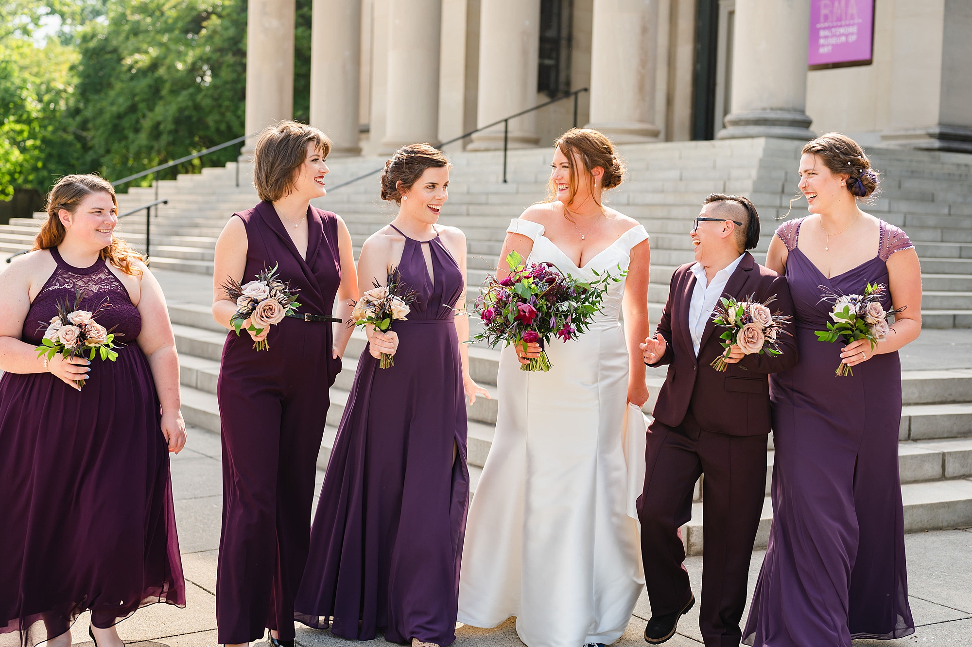 bride walks with wedding party outside Baltimore Museum of Art