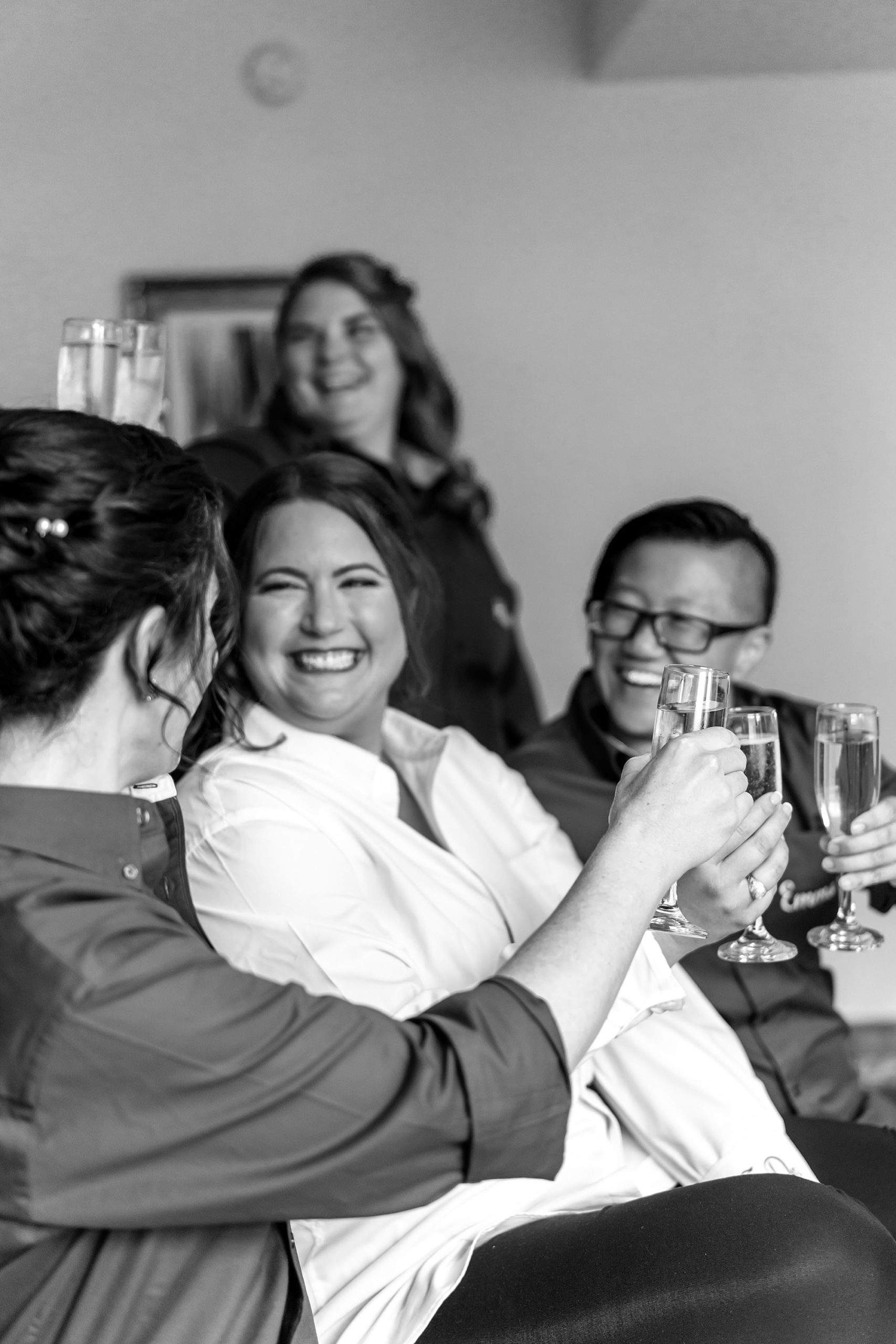 wedding party toasts champagne with bride