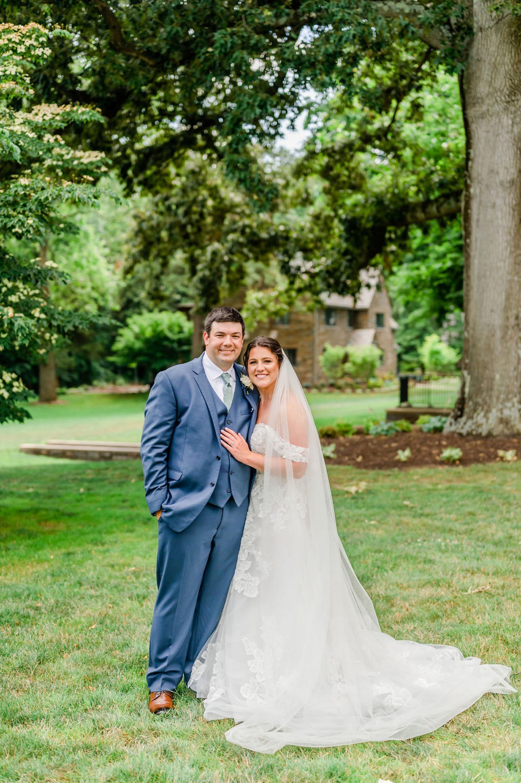 bride and groom hug during wedding portraits in Delaware 