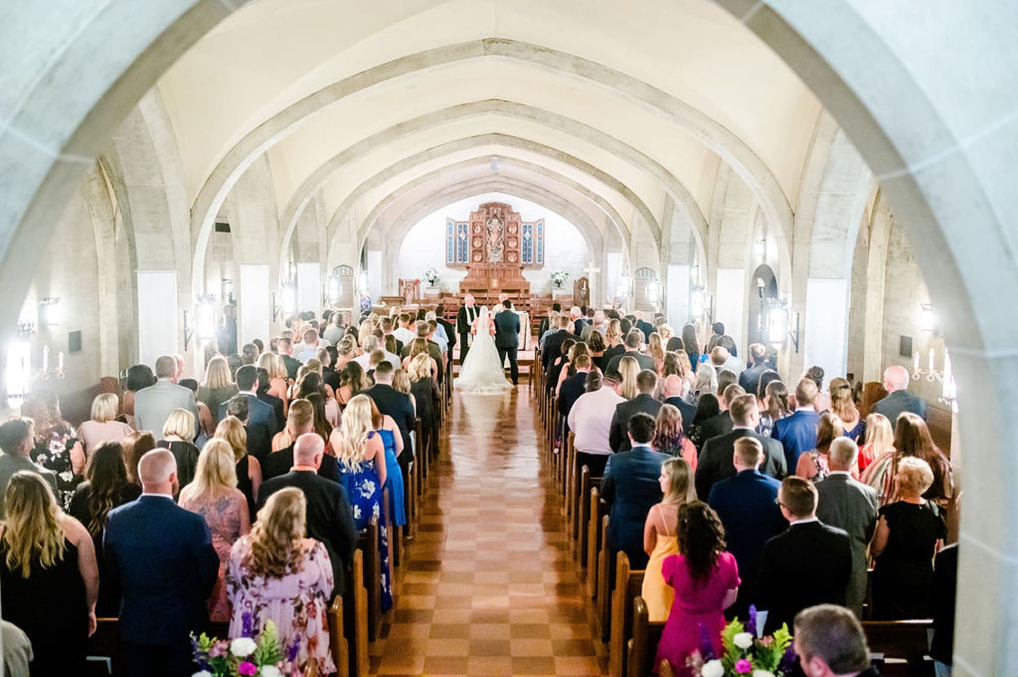 guests watch traditional church wedding at Saint Andrews in Delaware
