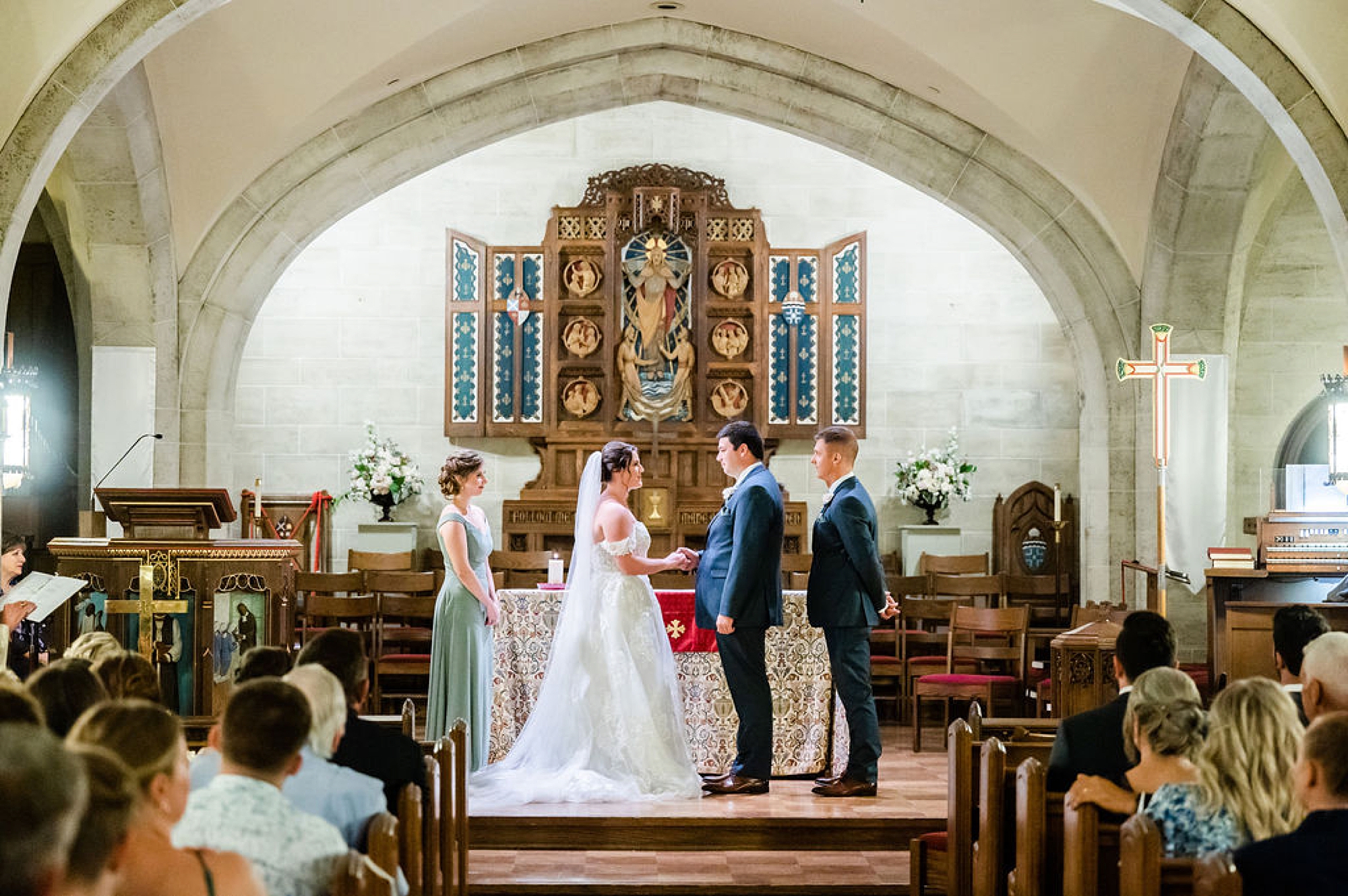 couple exchanges vows during traditional church wedding at Saint Andrews in Delaware