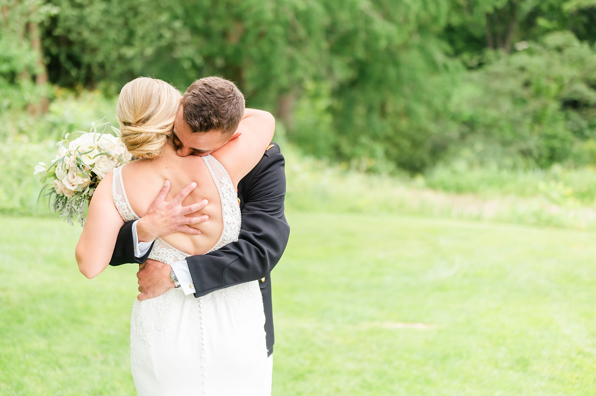 bride and groom hug during first look at Londontown Gardens