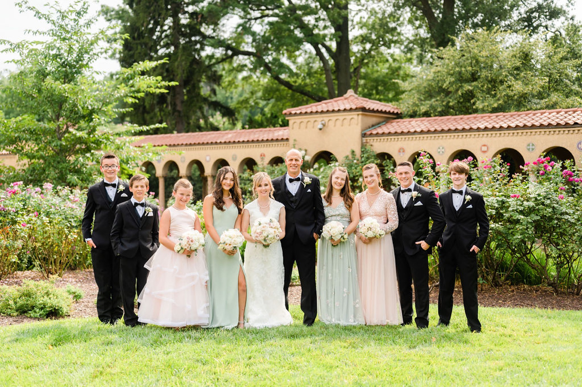 bride and groom pose with wedding party during DC photos 