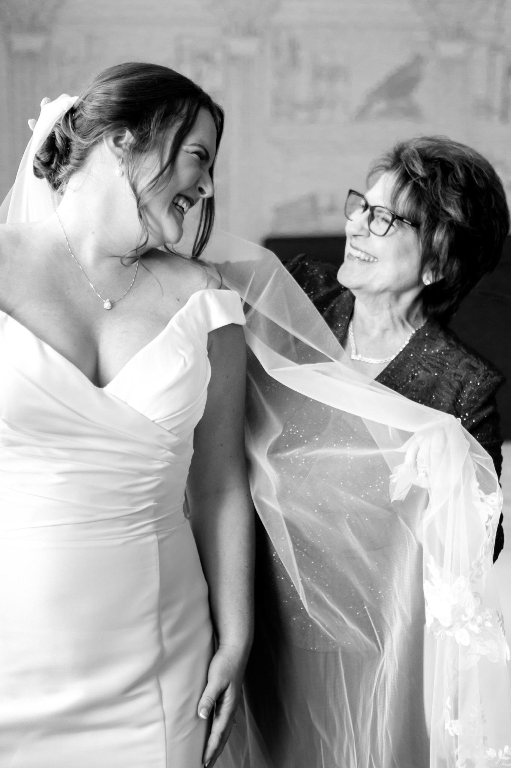 bride smiles at mother during prep for DC wedding