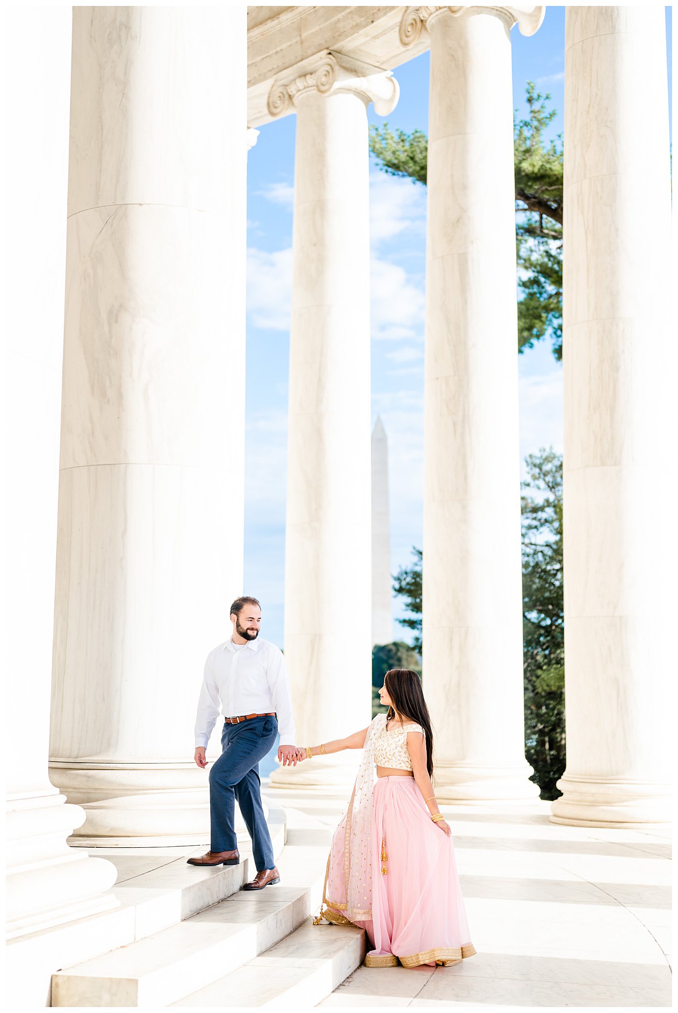 couple walks up steps of Jefferson Memorial