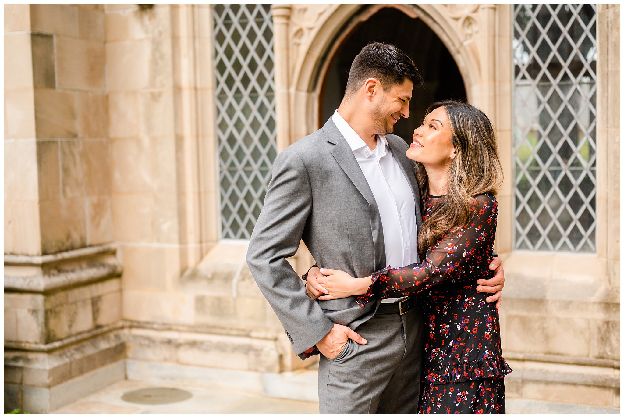 woman hugs fiancee and smiles at him during National Cathedral engagement session