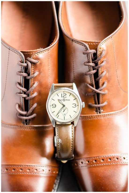 Grooms shoes with a watch
