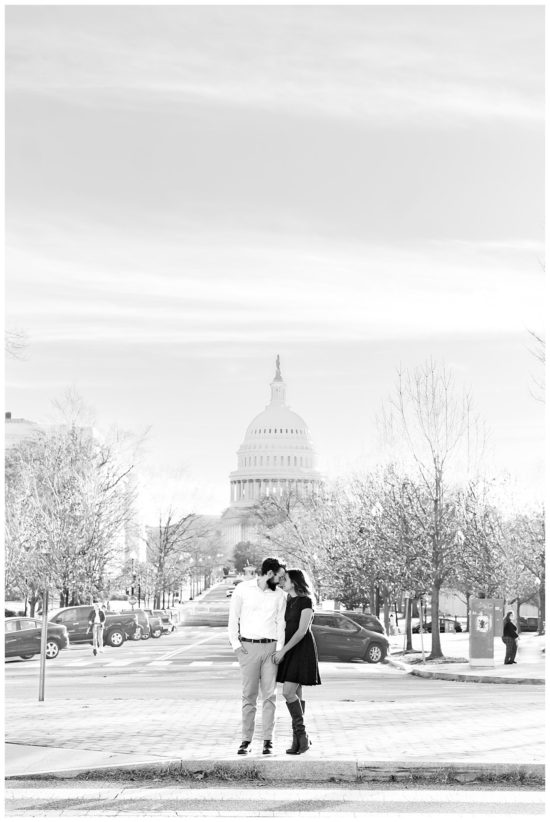 Couple is embracing with the capitol building behind them